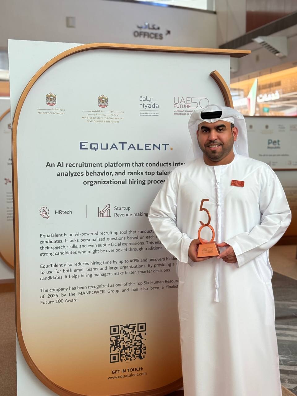 EquaTalent co-founder with the UAE Future 50 trophy at the EquaTalent stand